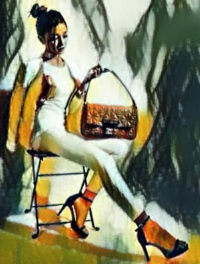 Young woman sitting with handbag